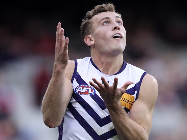 MELBOURNE, AUSTRALIA – AUGUST 04: Tom Emmett of the Dockers marks the ball during the round 21 AFL match between Essendon Bombers and Fremantle Dockers at Melbourne Cricket Ground, on August 04, 2024, in Melbourne, Australia. (Photo by Martin Keep/AFL Photos/via Getty Images)