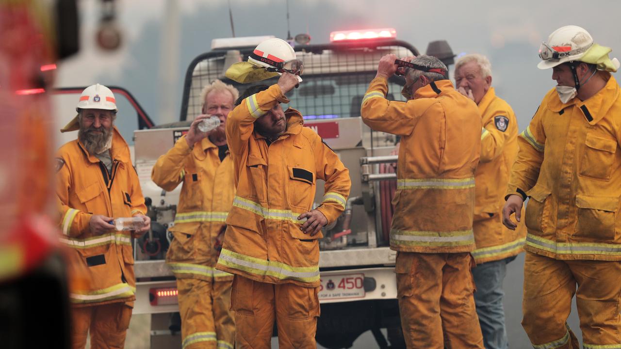 Members of Kempton fire brigade including Jack Jenkins (centre with hand on head) at the Pelham bushfire. Picture: LUKE BOWDEN