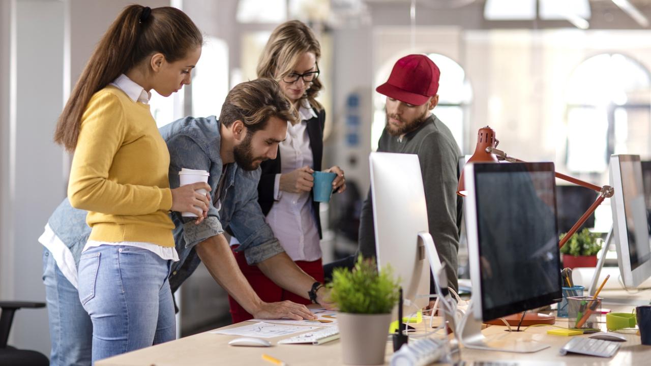 Four colleagues working together in the office. Picture: (istock)