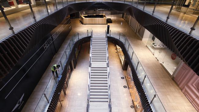 An empty Emporium shopping centre is deserted, apart from a lone cleaner. Picture: Darrian Traynor/Getty Images