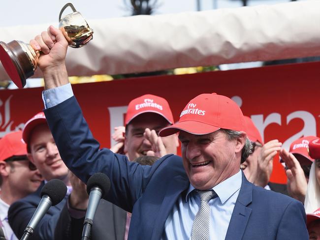 Prince Of Penzance’s trainer Darren Weir celebrates with the Melbourne Cup.