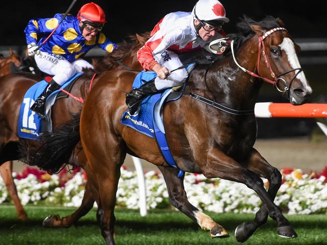Handsome Thief and Brad Rawiller salute under lights at at Moonee Valley last March. Picture: Getty Images
