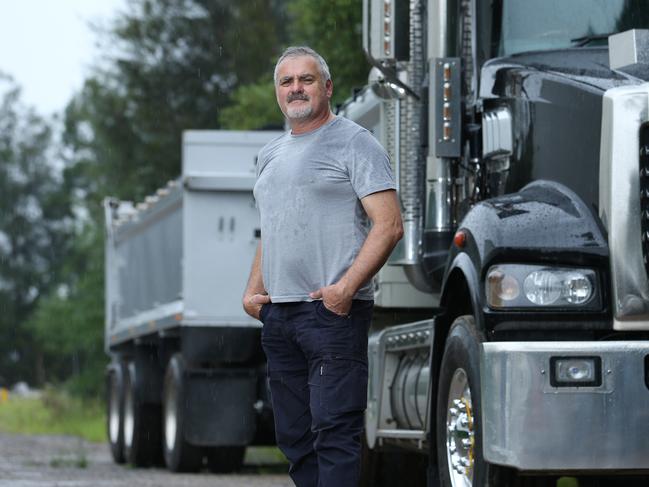 02/04/2020. Phil Ramondino, owner / driver, has driven trucks for 35 years, pictured with his Mack truck in Lidcombe in Sydney's West. He would like to see a cap on tolls throughout the coronavirus pandemic. SydneyÕs biggest toll operator intends not to freeze price increases during the coronavirus pandemic, arguing the revenue is funding projects that are keeping people employed during the crisis. Britta Campion / The Australian