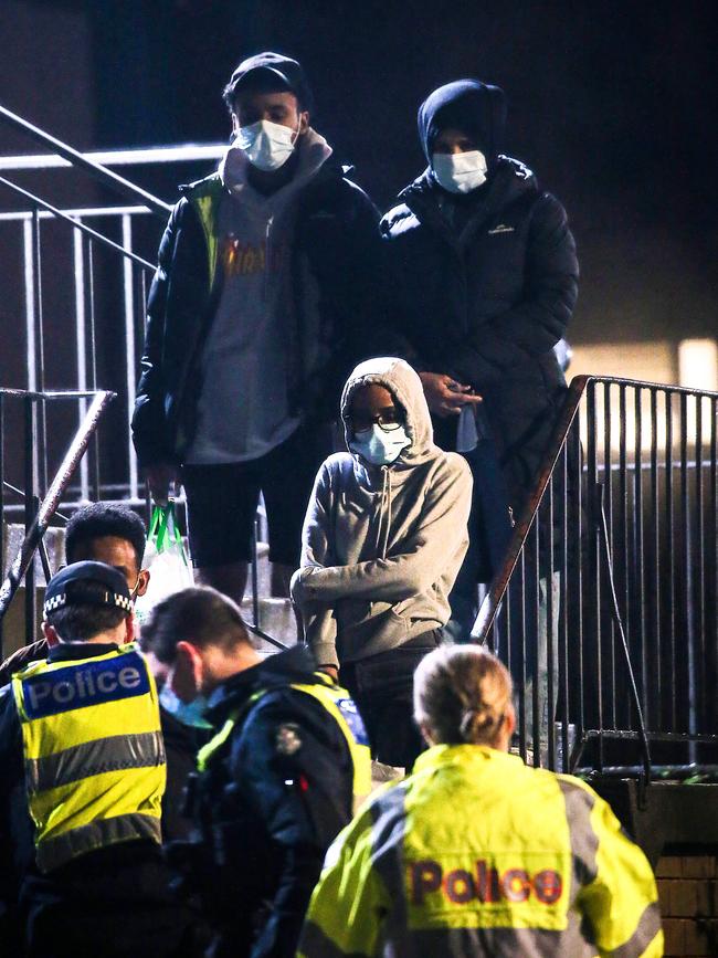 Police talk to residents at public housing towers in North Melbourne. Picture: Ian Currie