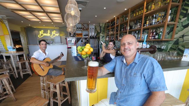 Arthur De Snoo has expanded his Beach Cafe in Surfers Paradise to add a bar in the tenancy next door. Arthur De Snoo and staff in the new bar. Picture Glenn Hampson