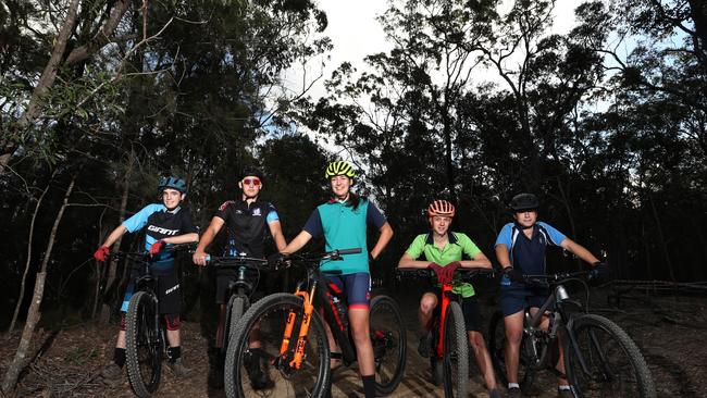 (L – R) Lachlan Glaser, Will Kelly, Hayley Oakes, Tobi Thompson and Dylan Edwards preparing for the National Mountain Bike Championships last year at Nerang on the Gold Coast. Photograph: Jason O'Brien