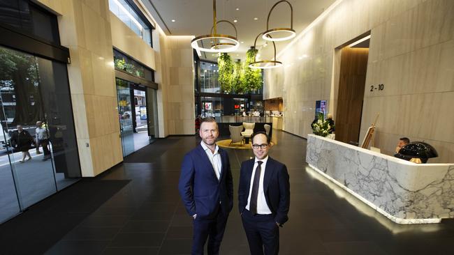 Joseph Dean and Kelly Moon from Colliers International in the newly-refurbished lobby at 66 Eagle St, Brisbane. Picture: Attila Csaszar