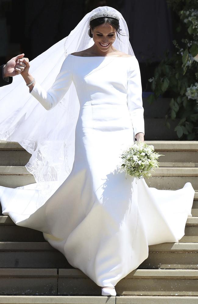 Meghan Markle and Britain's Prince Harry walk down the steps of St George's Chapel at Windsor Castle following their wedding in Windsor, near London, England, Saturday, May 19, 2018. Picture: Jane Barlow/AP