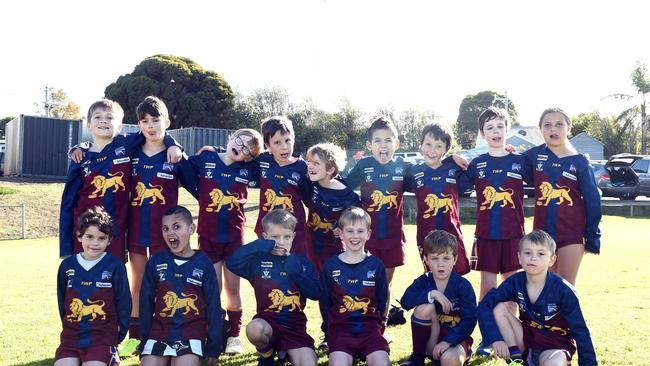 Belmont Lions under-9 football team pull their funniest faces.