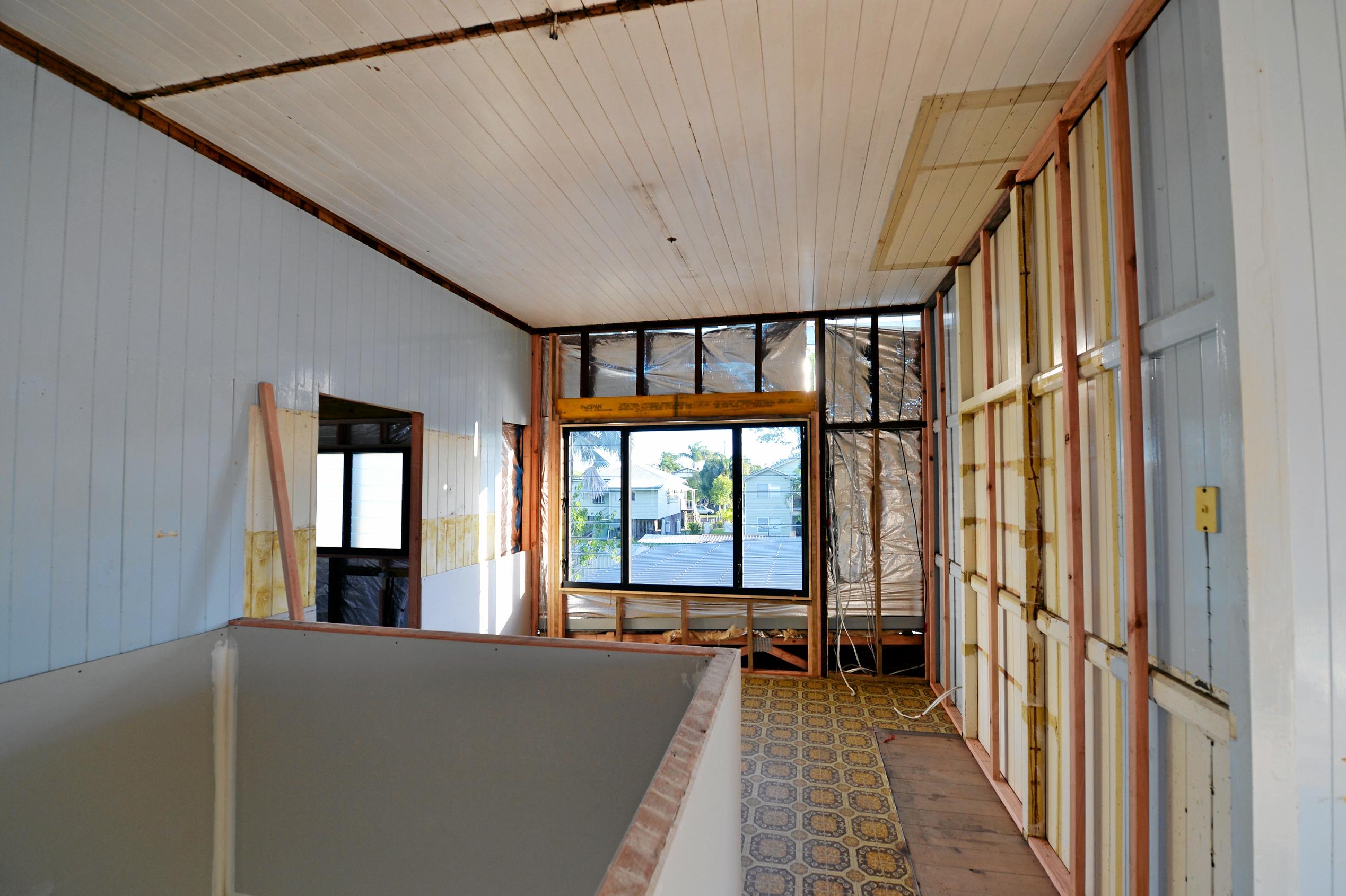 Mackay house-flippers Madison Strutynski and Michael Cotter at their Hunter St, West Mackay property. Picture: Stuart Quinn