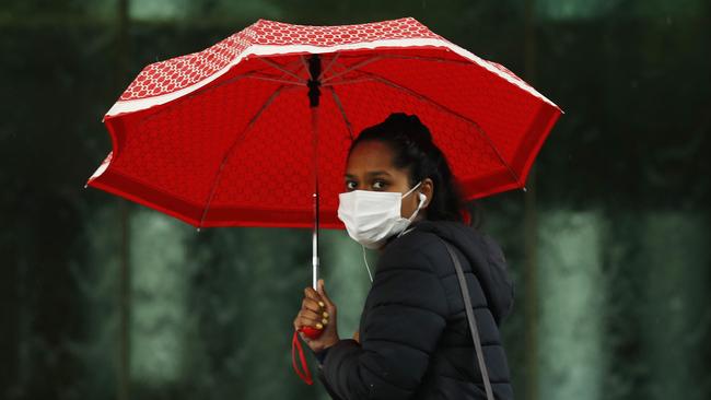 A woman walks past the NGV in Melbourne, Victoria. Picture: NCA NewsWire / Daniel Pockett