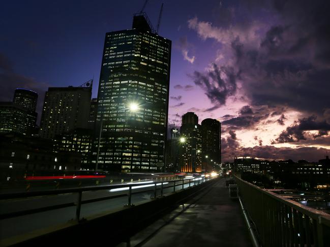 SYDNEY, AUSTRALIA - JUNE 21: Office buildings are seen illuminated in the central business district on June 21, 2022 in Sydney, Australia. The Australian Energy Market Operator (AEMO) indefinitely suspended spot markets in all regions of its National Electricity Market on June 15th citing critical power generation supply shortfalls and being unable to operate within the rules. Energy prices are rising steeply across the country and are expected to remain high for at least two years. (Photo by Lisa Maree Williams/Getty Images)