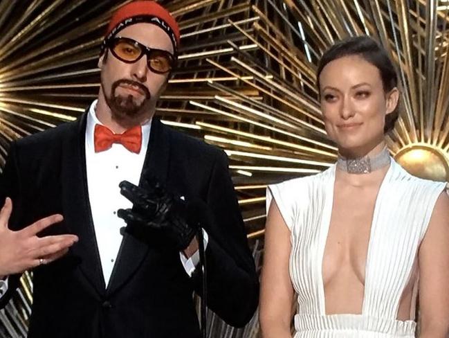 Olivia Wilde and Sacha Baron Cohen as Ali G.