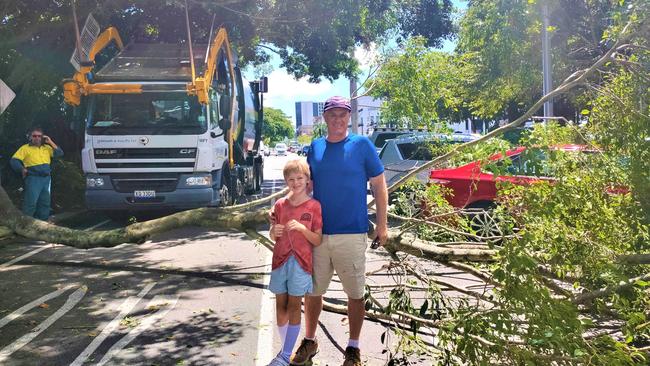 Cairns primary school teacher Paul Pudovskis and his son Preston got the fright of their life when a JJ Richards rubbish truck hit a tree and knocked a large branch onto their parked car outside the Reef Hotel Casino. Picture: Chris Calcino