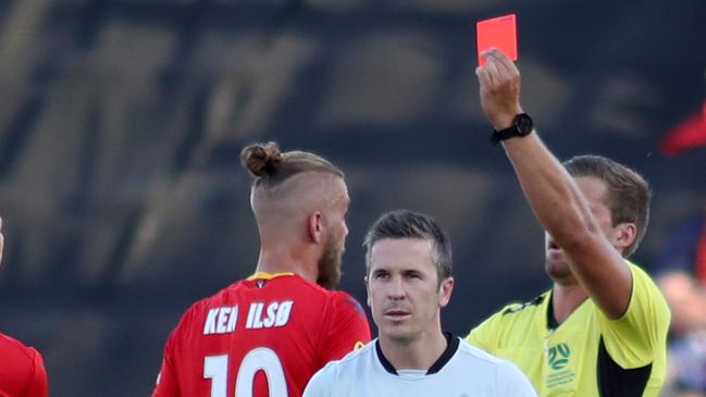 Adelaide United’s Ken Ilso, who has been suspended after returning a positive A-sample, was sent off in a match with Brisbane Roar this season. Picture: AAP Image/Kelly Barnes