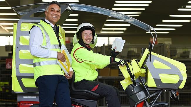 Australia Post chief Ahmed Fahour and postie Ron Trevillian. Picture: David Smith