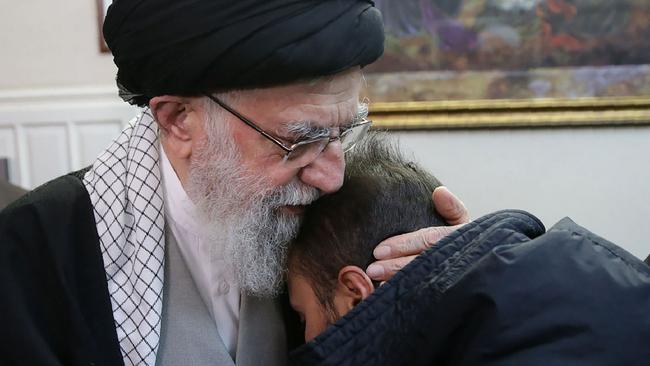 Iran’s Supreme Leader, Ayatollah Ali Khamenei, comforts a relative of Qassem Soleimani. Picture: AFP