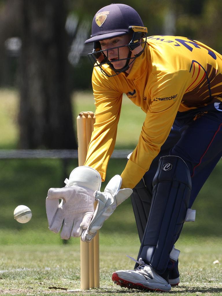 Kingston Hawthorn keeper Joel Lewis gets low for this one. Picture: Hamish Blair