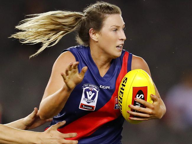 VFL Women's Grand Final at Etihad Stadium. Diamond Creek vs Darebin.  Diamond Creeks Amelia Barden tries to break the tackle  . Pic: Michael Klein