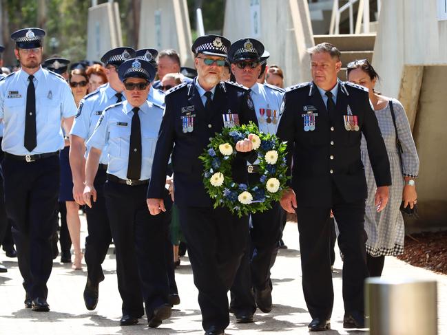 Mourners at the memorial service with full police honours for constables Rachel McCrow and Matthew Arnold at Brisbane Entertainment Centre. Picture: David Clark