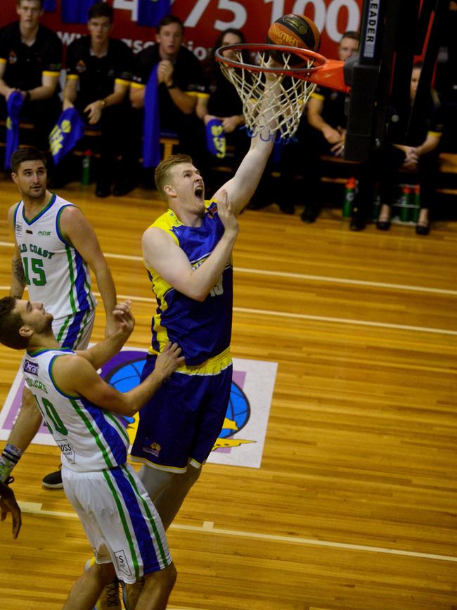 Queensland Basketball League quarter finals at Townsville Basketball Stadium. Townsville Heat against Gold Coast Rollers. Rollers' Jack McVeigh and Christian Salecich and Heat's Harry Frolling. Picture: Evan Morgan