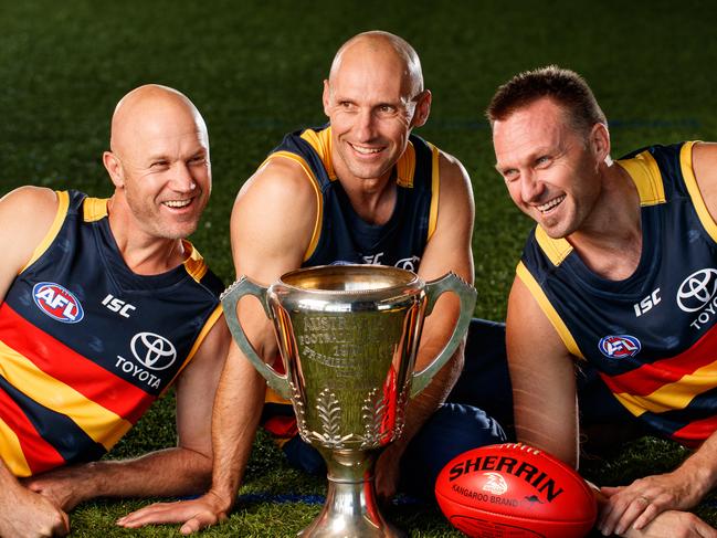 8/6/17 1997 premiership players Nigel Smart, Tyson Edwards and  Matthew Robran with the 1997 AFL Premiership Cup at The Adelaide Crows Football Club. Picture by Matt Turner.