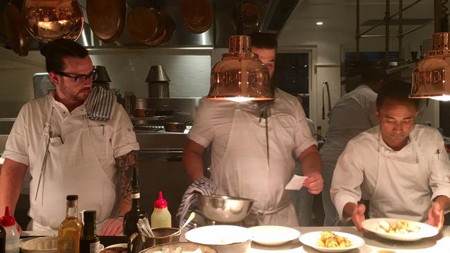 Executive chef Jordan Toft (left) and staff plating up at Bert's. Picture: Beverley Hudec.