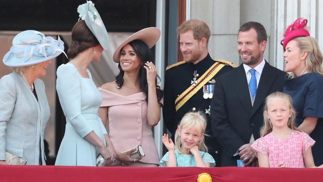 Camilla, Duchess Of Cornwall, Catherine, Duchess of Cambridge, Meghan, Duchess of Sussex, Prince Harry, Duke of Sussex, Peter Phillips, Autumn Phillips, Isla Phillips and Savannah Phillips on the balcony of Buckingham Palace. Picture: Getty Images