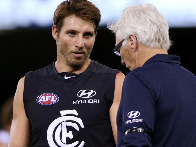 AFL Round 1: Carlton v Port Adelaide Etihad Stadium - Dale Thomas talks with Mick Malthouse at 3/4time. March 16th 2014 . Pic by Colleen Petch.