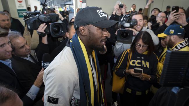 A huge media scrum greets Usain Bolt in Sydney. Picture: Getty.