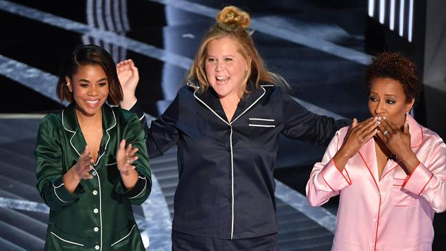 US actress Regina Hall (L), US actress and comedian Amy Schumer (C) and US actress and comedian Wanda Sykes speak onstage during the 94th Oscars. Picture: AFP