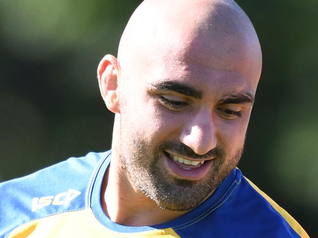 Parramatta Eels players Tim Mannah (left) and Mitchell Moses take part in a team training session at the Old Saleyards Reserve, in Sydney, Monday, April 1, 2019. (AAP Image/Joel Carrett) NO ARCHIVING