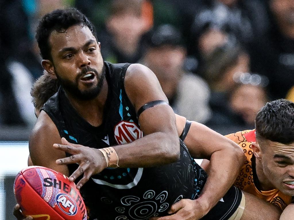 ADELAIDE, AUSTRALIA – MAY 19: Willie Rioli of the Power tackled by Karl Amon of the Hawks during the round 10 AFL match between Yartapuulti (the Port Adelaide Power) and Hawthorn Hawks at Adelaide Oval, on May 19, 2024, in Adelaide, Australia. (Photo by Mark Brake/Getty Images)