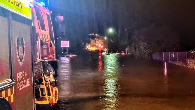 Fire and Rescue NSW crews attend Menangle Rd Campbelltown after an elderly couple were trapped in a car by rising floodwaters on March 7. Picture: Fire and Rescue NSW