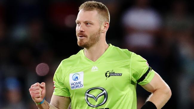 CANBERRA, AUSTRALIA - DECEMBER 14: Nathan McAndrew of the Thunder celebrates after claiming the wicket of Tom Cooper of the Heat during the Big Bash League match between the Sydney Thunder and the Brisbane Heat at Manuka Oval, on December 14, 2020, in Canberra, Australia. (Photo by Brendon Thorne/Getty Images)