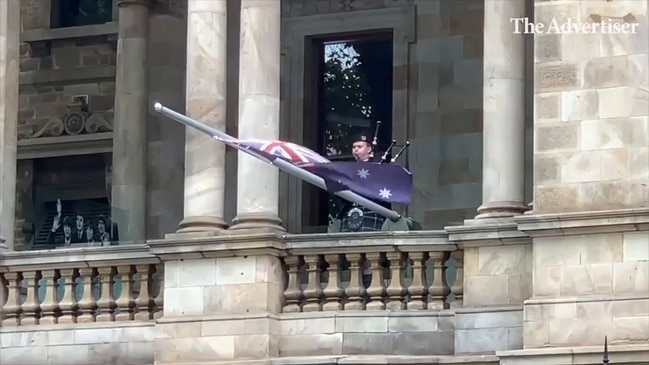 Teen lone piper plays Amazing Grace on the Adelaide Town Hall balcony