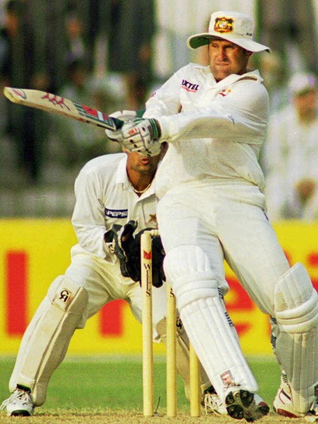 Mark Taylor pulls leg-spinner Mushtaq Ahmed for a four.