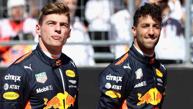 Daniel Ricciardo (R) with teammate Max Verstappen.