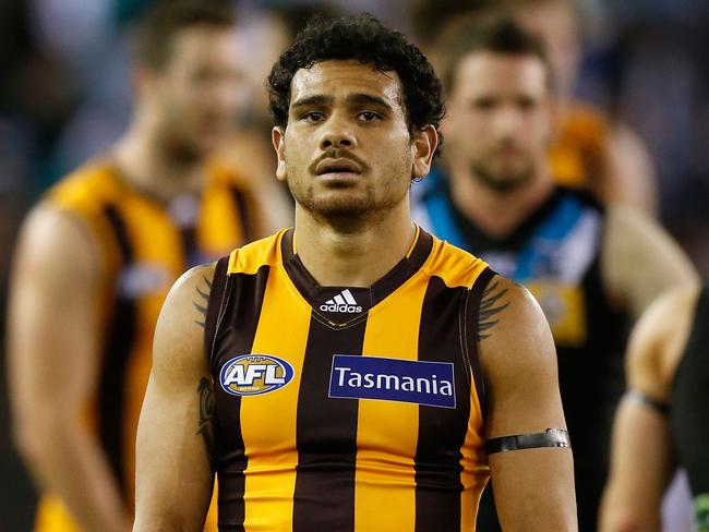 MELBOURNE, AUSTRALIA - AUGUST 21: Cyril Rioli of the Hawks looks dejected after a loss during the 2015 AFL round 21 match between the Hawthorn Hawks and Port Adelaide Power at Etihad Stadium, Melbourne, Australia on August 21, 2015. (Photo by Adam Trafford/AFL Media/Getty Images)