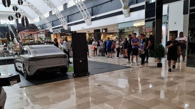 Onlookers at the shopping centre rush to see the dramatic scene. Picture: 9News