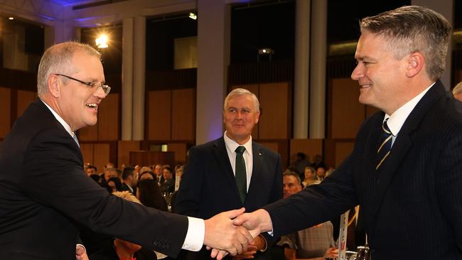 Treasurer Scott Morrison shaking hands with Finance Minister Mathias Cormann before giving a National Press Club in the Great Hall at Parliament House in Canberra. Picture Kym Smith