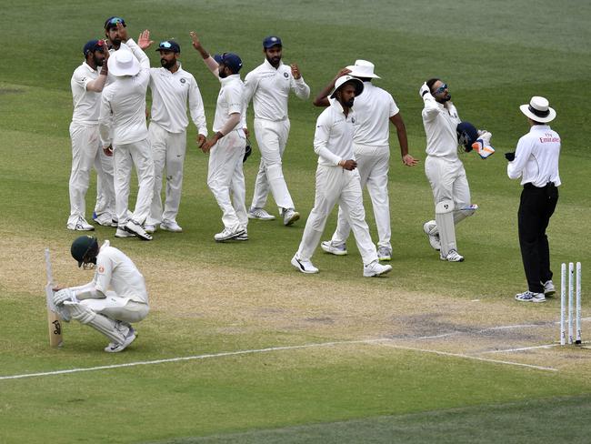 India players celebrate the win during day five of the first Test match between Australia and India at the Adelaide Oval in Adelaide, Monday, December 10, 2018. (AAP Image/Kelly Barnes) NO ARCHIVING, EDITORIAL USE ONLY, IMAGES TO BE USED FOR NEWS REPORTING PURPOSES ONLY, NO COMMERCIAL USE WHATSOEVER, NO USE IN BOOKS WITHOUT PRIOR WRITTEN CONSENT FROM AAP