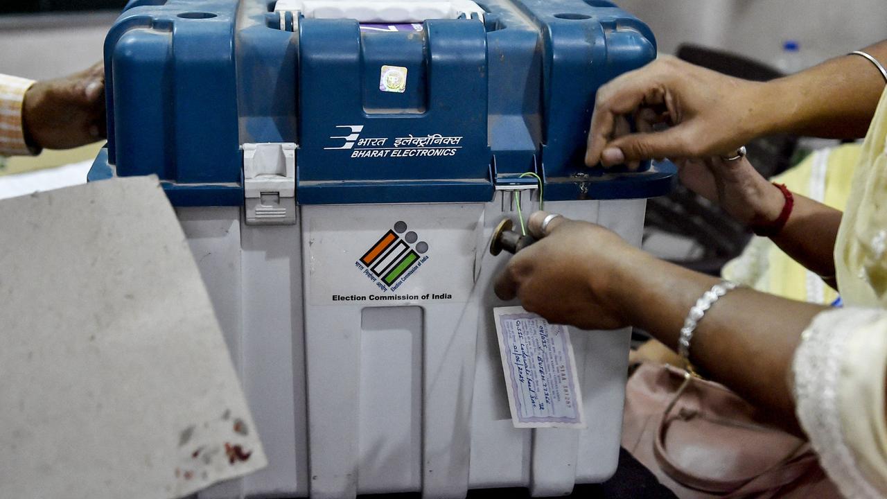 Polling officials seal Electronic Voting Machines (EVMs) and Voter Verifiable Paper Audit Trail (VVPAT) at the end of the seventh and final phase of voting in India's general election. Picture: AFP