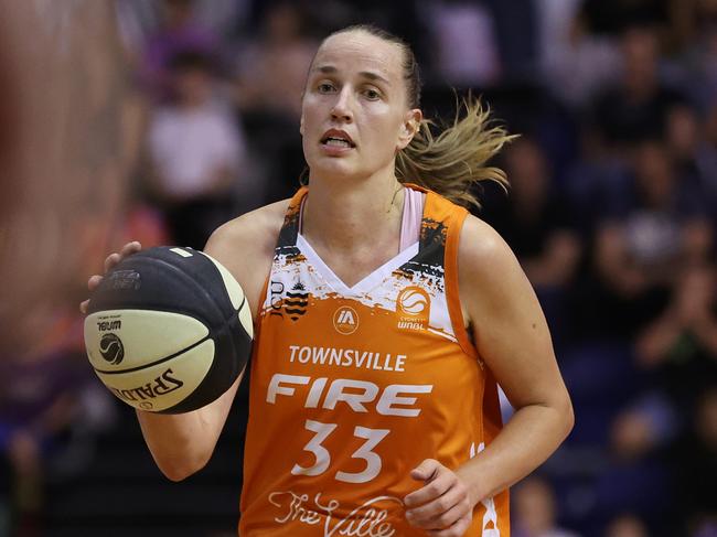 MELBOURNE, AUSTRALIA - JANUARY 13: Mikaela Ruef of the Fire looks to pass the ball during the WNBL match between Melbourne Boomers and Townsville Fire at Melbourne Sports Centres - Parkville, on January 13, 2024, in Melbourne, Australia. (Photo by Daniel Pockett/Getty Images)