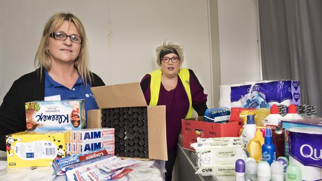 Supplies for women from FoodAssist. Tess Heming, support worker with St Vincent de Paul and Annette Rose general manager Actscare.