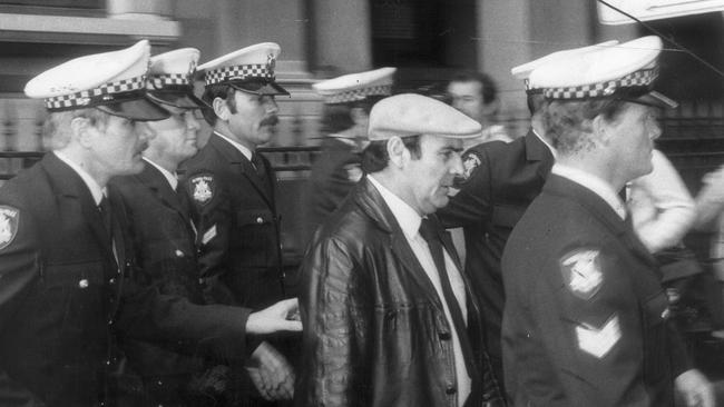 Police escort Gianfranco Tizzoni to court after he pleaded guilty of having conspired to murder Donald Mackay. Picture: Supplied