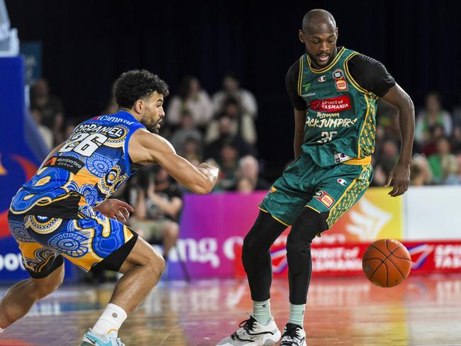 LAUNCESTON, AUSTRALIA - NOVEMBER 04: Milton Doyle and Sam McDaniel scrap for a ball during Tasmania’s win over Brisbane at The Silverdome on Saturday. (Photo by Simon Sturzaker/Getty Images)