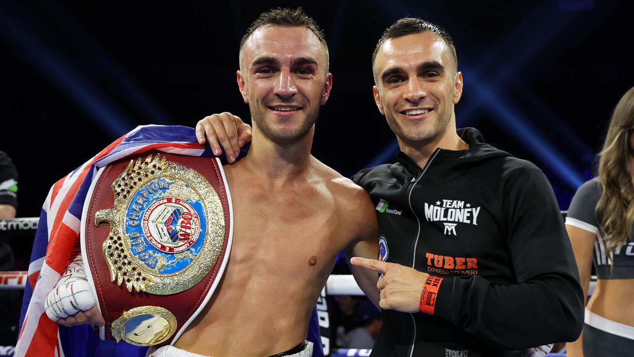 Jason Moloney (L) and twin brother Andrew Moloney (R) celebrate after Jason’s victory over Vincent Astrolabio, for the WBO bantamweight championship at Stockton Arena on May 13, 2023 in Stockton, California. (Photo by Mikey Williams/Top Rank Inc via Getty Images)