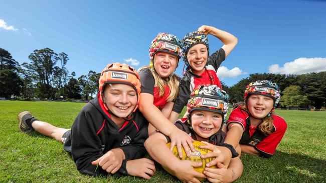 Five junior players from Trentham Football/Netball Club L to R Darcy Thompson, 10, Ellie Handley, 10 Harley Thompson, 12, Mason Thompson, 6, and Taylah Handley, 11 Wearing helmets. The club has introduced compulsory helmets for under-14s, which follows on from under-11s having to wear them. Now the team will have new changes to deal with this year. Picture: Tim Carrafa