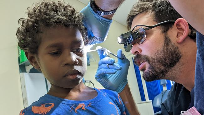 Kowanyama boy Tyrell Tybingoompa getting an ear test as part of the Torres and Cape Hospital and Health Service Integrated Ear, Nose and Throat. program. Picture: Supplied